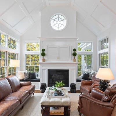 Addition interior view of fireplace, TV cabinet, vaulted tray ceiling